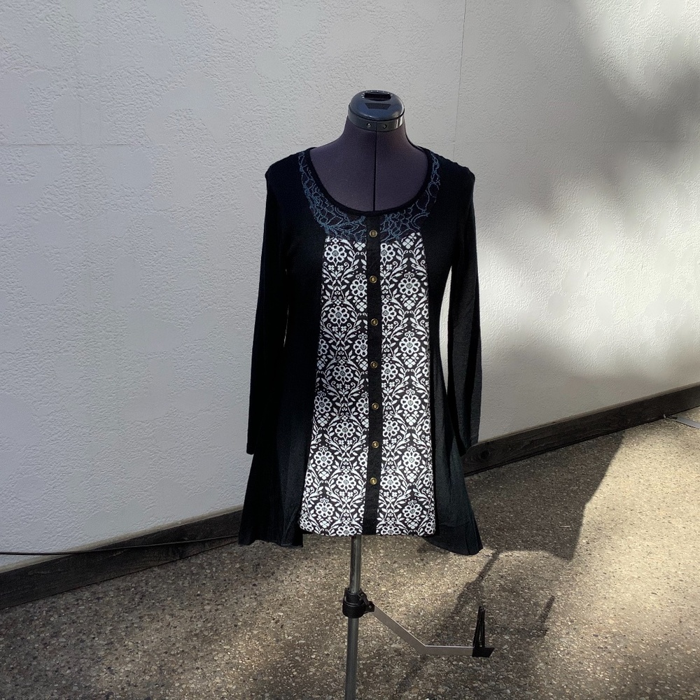 Papillon long sleeve light weight button front size small never worn.